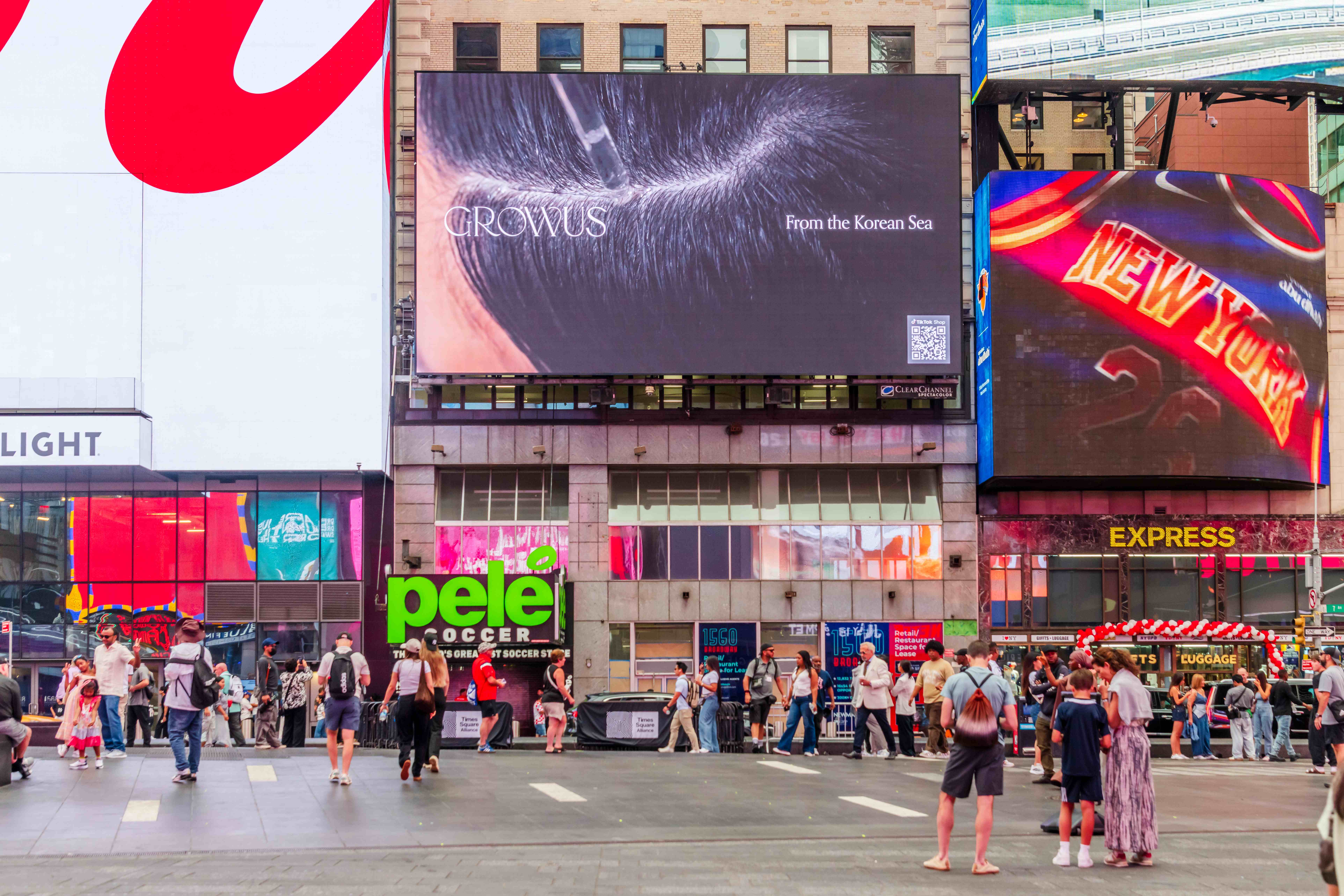 GROWUS "From the Korean Sea" creative on the 1560 Broadway billboard, framed by neighbouring Times Square screens