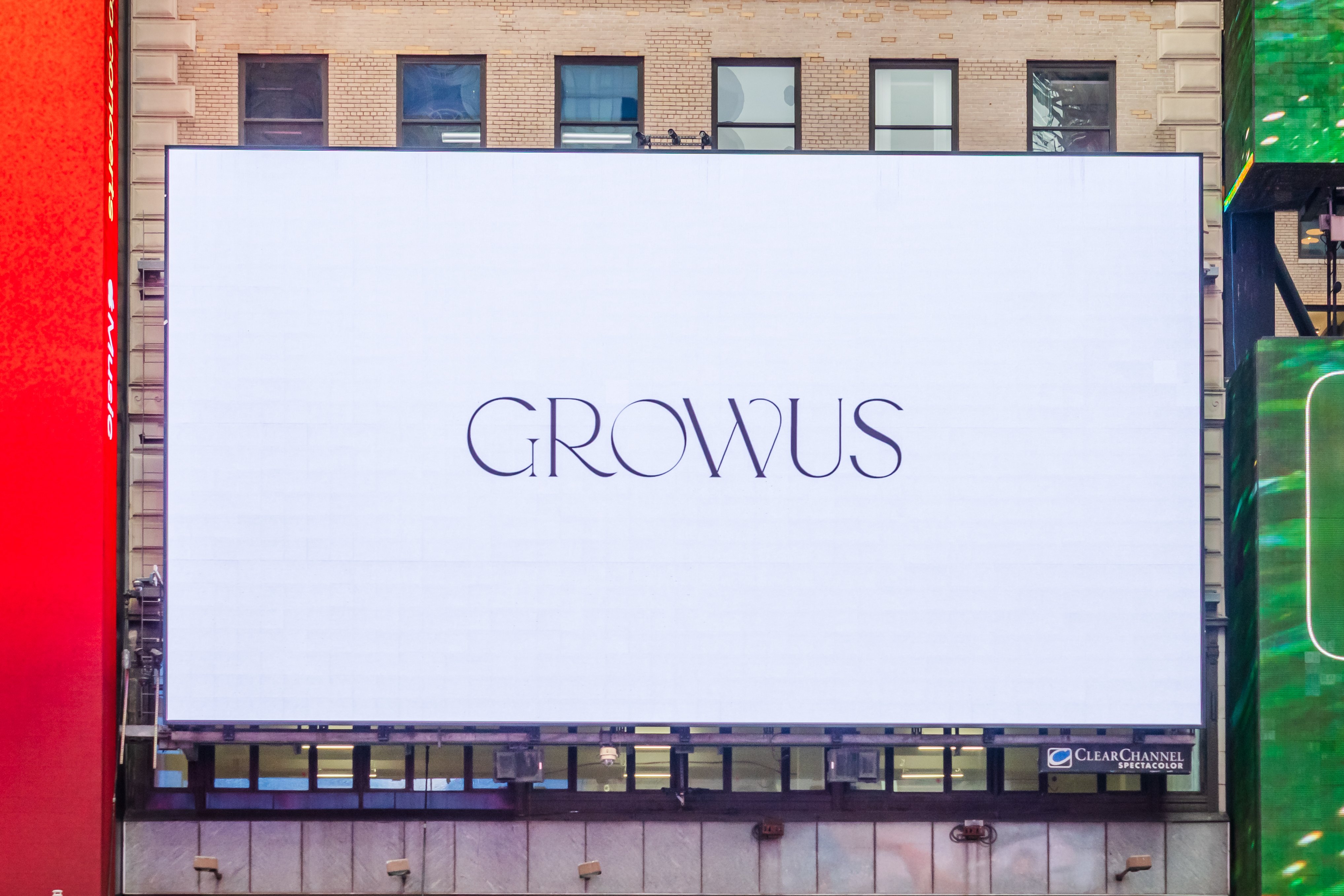 Close view of the GROWUS wordmark on the 1560 Broadway digital billboard, Times Square